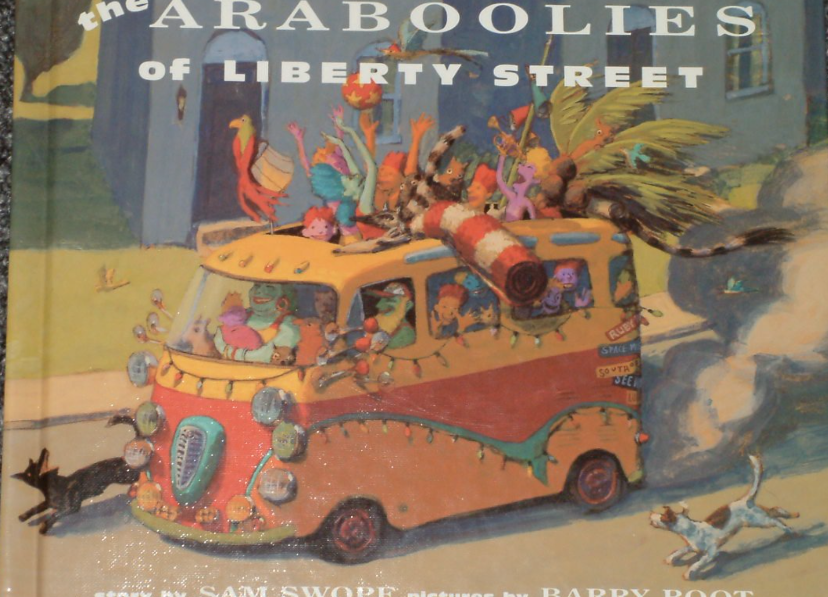 Illustrated book cover for The Araboolies of Liberty Street with a drawing of a colorful bus overflowing with happy people and animals. A gray house stands in the background.