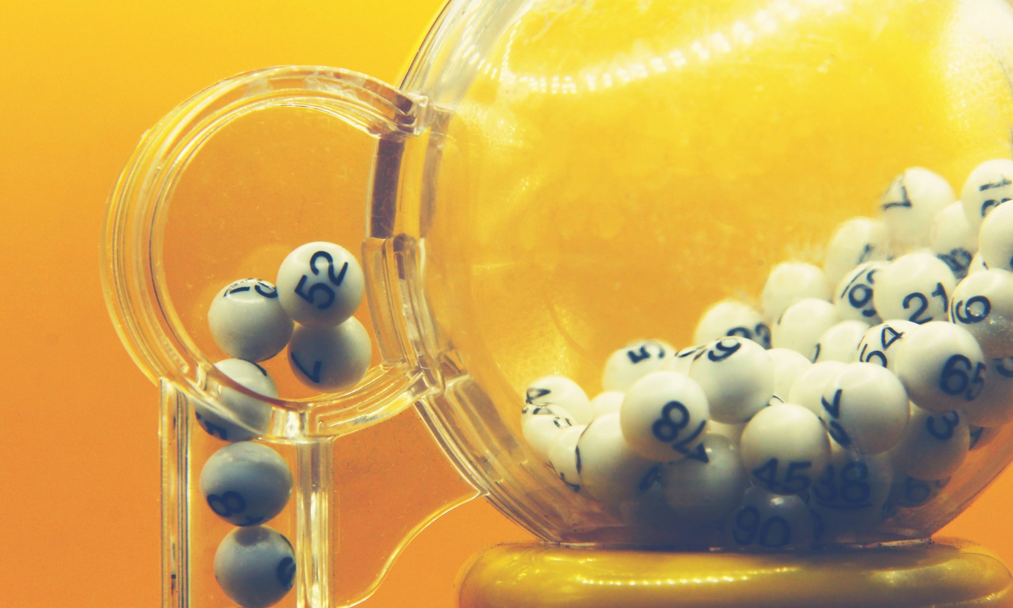 photograph of bingo balls in a lottery machine