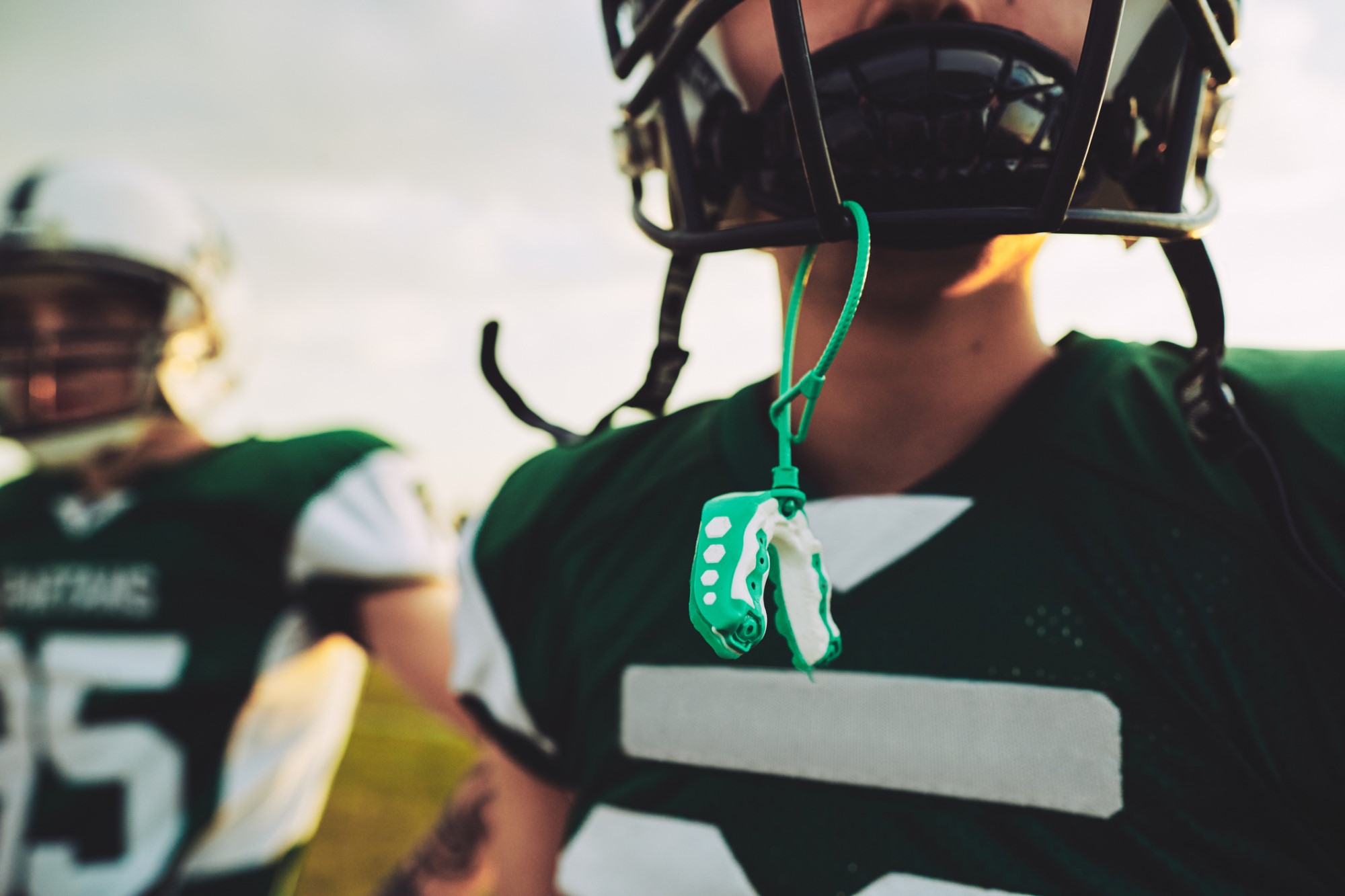 photograph of football player with mouthguard out